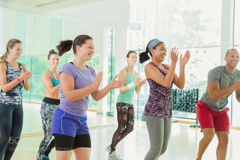 Smiling students clapping in aerobics class by caia_images Aerobics Classes, Stay Fit, Lily Pulitzer, Lily Pulitzer Dress, Lilly Pulitzer