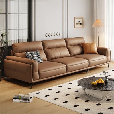 Introduce our sofa, a contemporary design that embodies minimalist elegance. The sofa features a soft and pleasing pink hue that complements its Genuine Leather upholstery. This high-quality leather offers a luxurious touch, offering unparalleled durability and a smooth, supple feel. The seat cushions are filled with a combination of high-density foam and latex, ensuring a plush seating experience. This unique filling provides exceptional comfort, with a soft yet resilient feel. The back cushion Stone Leather Sofa Living Room, Chaise Longue, High Back Leather Sofa, Leather Sofa Design Living Rooms, Sofa Design Office, Best Sofa Designs For Living Room, Italian Sofa Design Luxury, Lounge Design Interior, Leather Sofa Design