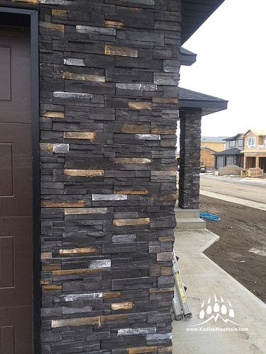 RR Masonry in Lethbridge Alberta Canada shows off its work with Greenwood Homes. Here is our Stacked Stone profile in our Black Diamond color. www.KodiakMountain.com Home Elevation Tiles Design, Show Wall Design Exterior, Indian House Front Wall Tiles Design, Outside Wall Tiles, Tiles For Outside House Wall, Home Front Wall Tiles Design, Elevation Tiles Outdoor Wall, Wall Stone Design, Exterior Wall Decor