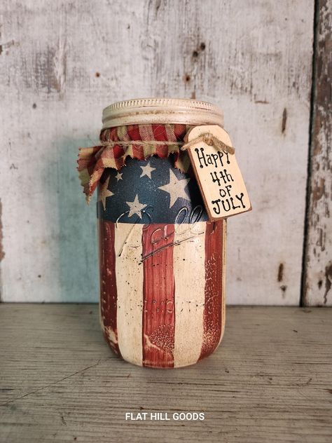 Size: 7" Tall x 3 1/2" Primitive Americana on Ball Mason Canning Jar JAR #2 Americana  Jar is Very Rustic / Primitive Hand Painted Canning Jar. Has crackle, sanded off paint, heavily antiqued, aged and flicked with black paint The jar has been sealed, finished with homespun top. and wood tag.  Current Tag reads: Happy 4th of July.  Choose your saying. Do not submerge the jars underwater or let them soak in the sink. For Decorative Use Only. Most items in my shop are pre loved and show wear. The majority of my pieces are painted on salvaged wood, barn board, pine and are in rustic condition. Finishes may differ as materials and wood take paint and mediums differently. No two items are alike as I do the finish painting, distressing and antiquing by hand. I will combine shipping and any amoun Painting Canning Jars, Primitive Mason Jars, Americana Kitchen, Rustic Americana, Primitive Americana, Ball Jar, Wood Barn, Wood Tags, Canning Jar