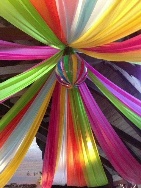 Saw this on Pinterest and executed this for a party!!! It came out great and we got the plastic tablecloths from Oriental Trading, best selection in colors....we used a huge beach ball for the center as this was for a Big event for our beach club!! This takes time, some ladders in a room this scale but it was a hit!! GG 70s Party Theme, 1980s Party, 80s Theme Party, Hippie Party, Fun Fun Fun, Beach Music, 70s Party, 80s Theme, Love Beach