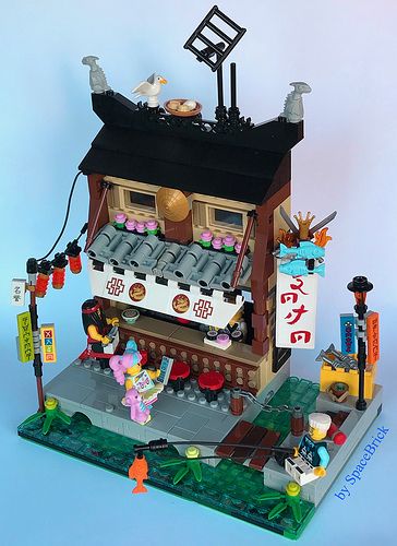 This wonderfully detailed scene by SpaceBrick will leave you wanting more. Lego Samurai, Ramen And Sushi, Lego Ninjago City, Lego Minifigure Display, Ninjago City, Lego Designs, Lego Village, Lego Buildings, Micro Lego