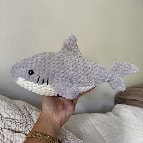 this cute shark plush is the perfect accessory for your desk, bed, car, or gift for someone special!  available in the colors shown (grey, ivory) (indigo, ivory) / or let me know if you want a different color! (main color and accent color) made with chenille yarn and safety eyes about 12" long Crochet Shark Amigurumi, Grey Crochet Animals, Shark Crochet Plushie, Cute Shark Stuff, Cute Crochet Room Decor, Big Crochet Plushies, Crochet Chenille Yarn, Crochet Shark Pattern, Shark Crochet