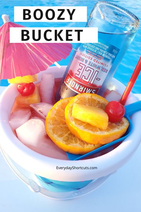 This is going to be your favorite drink for the pool and it's all in a massive beach bucket. Garnish with fruit and enjoy! Fishbowl Drink, Pool Drinks, Sand Bucket, Drink Bucket, Summer Drinks Alcohol, Party Drinks Alcohol, Yummy Alcoholic Drinks, Beach Drinks, Beach Bucket