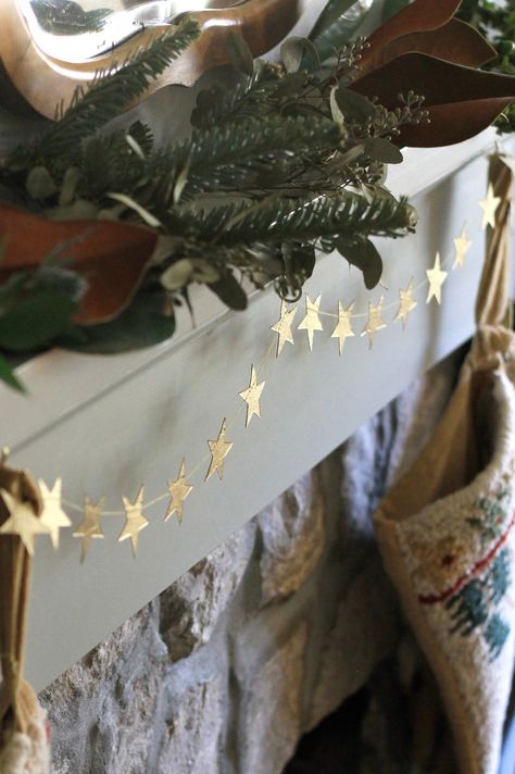 This is such a unique item. Handmade by women in Nepal of natural materials, a string of gold stars wrapped around a gift card with an envelope. Garland is 42" long.