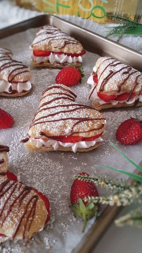 Strawberry cream puffs are delightful pastries filled with a luscious strawberry cream filling. Here's a description of these delectable treats: Pastry shells: The pastry shells are made from choux pastry, a light and airy dough that puffs up when baked. The dough is prepared by combining flour, butter, water, and sometimes eggs. It is then piped onto a baking sheet and baked until golden and crispy on the outside while remaining hollow on the inside. The result is a delicate and crispy shell Strawberry Cream Puffs, Strawberry Cream, Sweet Snacks Recipes, Think Food, Whipping Cream, Fresh Strawberries, Cream Puffs, Fun Baking Recipes, Easy Baking Recipes