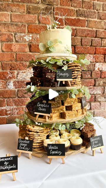 Naomi Spaven on Instagram: "Kate & Ricky’s Wedding Cake Tower 🫶🏼  Making these wedding cakes is possibly my favourite thing that has come from Little Welsh Foodie🥹  Getting to chat with the couples before hand and discuss what bakes and flavours are their favourite, right through to sitting with my dad sticking rope and leaves to the stand…I just love the whole process🫶🏼  Kate & Ricky had a beautiful wedding and I was so grateful to not only provide the cake, but also spend the evening at the wedding, chatting with people about the bakes and watching people demolish it😂  ON THE STAND: 🍰 3 Layer Victoria Sponge Cake 🍪 Vegan Chocolate Orange Cookies 🌾 Gluten + Dairy Free Choc Nut Flapjacks ✨ Cornflake Cakes (personal fave) 🍫 Triple Chocolate Brownies 🤍 White Chocolate Blondies 🧁 Welsh Cake Wedding Cake, Wedding Cake With Cookie Tiers, Chocolate Brownie Wedding Cake, Wedding Cake Dessert Ideas, Wedding Cake With Brownies, Wedding Cake And Brownies, Wedding Brownie Cake, Coffee Cake Wedding Cake, Wedding Cake 50 People