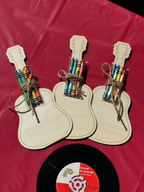 Add a creative and musical touch to your next party with these Wooden Laser Cut Guitar Coloring Boards! Makes the perfect music lover party favors for all your music themed parties! Each set comes with a selection of vibrant crayons, making it easy for guests to personalize their guitars with their favorite colors. Whether you're hosting a birthday party, a music-themed event, or just looking for a fun activity, these coloring boards are sure to strike the right chord. Unleash your inner artist Music Themed Party Favors, Music Crafts For Adults, Johnny Cash Themed Birthday Party, Music Themed Decorations, Classic Rock Birthday Party, 2nd Birthday Music Theme, Musical Themed Birthday Party, Rock And Roll Theme Party Decorations, Music Themed 1st Birthday Party