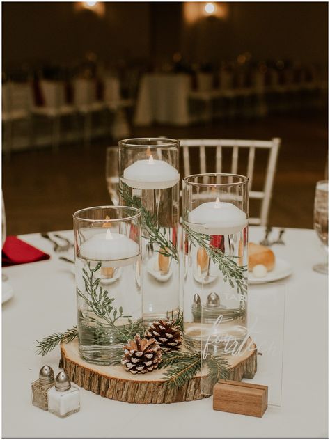 Add a touch of holiday magic to your winter wedding! Check out this Renault Winery Christmas Wedding for holiday and winter wedding ideas. With stunning tablescapes adorned with pine cones and garland, to festive candlelit table centerpieces. Create a winter wonderland celebration that will leave your guests in awe and inspired!  Photography by Sydney Madison Creative Winter Wedding Souvenirs, Easy Christmas Wedding Centerpieces, Christmas Themed Wedding Table Decor, Winter Wreath Centerpiece Wedding, Winter Wedding Cocktail Hour Decor, December Wedding Decor Ideas, Pine Winter Wedding Centerpieces, Pine Cones Wedding Decor, Pine Decoration Ideas Wedding