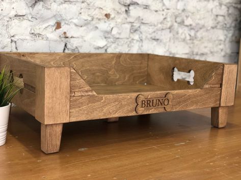 "Customizable Raised wooden dog bed is created for small and large pets. This elevated engraved dog bed will be a stylish decoration of your interior. * * DESCRIPTION * ➡️ Wooden bed materials: top quality plywood; 12 mm, 6 mm ➡️ Reinforced bottom, 8 mm ➡️ Legs are made of natural wood, height 3 inches (7 cm) ➡️Bed Color: brown, gray, dark brown * MORE * Modern dog bowls https://www.etsy.com/listing/1029845884 * SIZES * EXTRA SMALL (XS): fits for miniature dog breeds (Pekingese, Chihuahua, etc.) Wooden Dog Bed Ideas, Wood Pet Bed, Homemade Dog Beds For Small Dogs, Dog Wooden Bed, Pekingese Chihuahua, Dog Bed Wood, Wooden Dog Bed Frame, Raised Wooden Dog Bed, Rustic Dog Beds