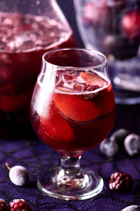 This Halloween, we're stirring our cauldron with this delicious cocktail we call black magic sangria. A cocktail you've been looking for all fall is finally here, and you can make it in just a few easy steps. You need fresh or frozen blackberries, black grapes, black plums, 1 bottle full-bodied red wine, brandy, crème de cassis and seltzer or club soda. Red Sangria Recipes, Black Plums, Pitcher Cocktails, Red Wine Sangria, Black Grapes, Halloween Cocktails, Vanilla Essential Oil, Citrus Fragrance, Sangria Recipes