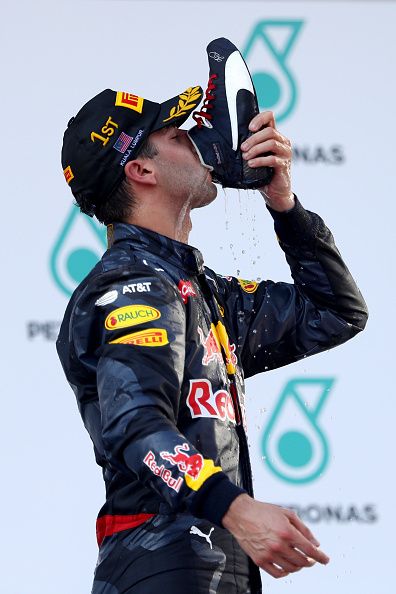 Daniel Ricciardo of Australia and Red Bull Racing celebrates his win on the podium during the Malaysia Formula One Grand Prix at Sepang Circuit on... F1 Wallpaper Ricciardo, Daniel Ricciardo Wallpaper Red Bull, Daniel Riccardo Wallpapers, Daniel Ricciardo Wallpaper Iphone, F1 Drivers Wallpaper, Daniel Ricciardo Aesthetic, Daniel Ricciardo Wallpaper, F1 Daniel Ricciardo, F1 Icons