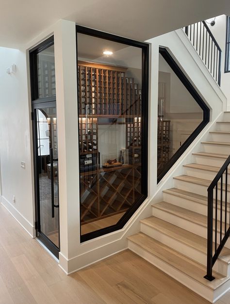 Staircase With Wine Cellar, Modern Wine Room Ideas In House, Wine Cellar In House, Wine Cellar Below Stairs, Glass Wine Room Under Stairs, Kitchen Wine Cellar Ideas, Wine Bar Room In House, Wine Cellar In Garage, Stairwell Wine Cellar