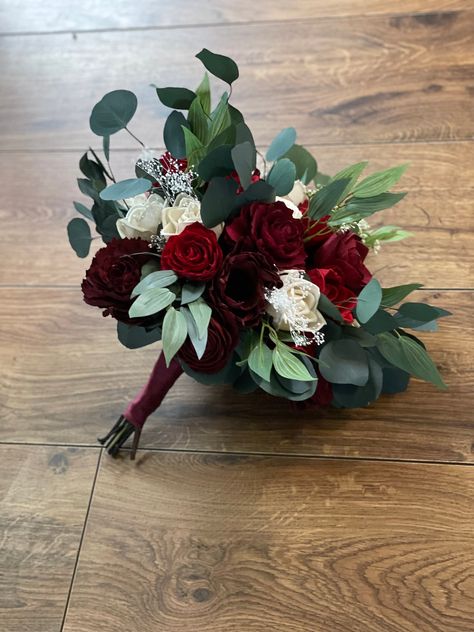 Sola wood flower bouquet with red  flowers. Preserved eucalyptus as well as artificial . Size pictured is medium. Bouquet  can also be made in small or large.MADE TO ORDER!! Each flower is hand made and painted so a slight variation in placement may occur from one bouquet to the next. Please allow 8-10 weeks for shipping. Can also add matching  bridesmaid bouquets boutonnieres and corsages per request ! Message me for custom orders For matching boutonnieres--> https://www.etsy.com/listing/740856 Eucalyptus And Red Roses, Bride Bouquets Red Roses, Homecoming Bouquets, Red White Bouquet, Red Floral Arrangements, Wood Flowers Wedding, Red Wedding Bouquet, Red Rose Bridal Bouquet, Medium Bouquet