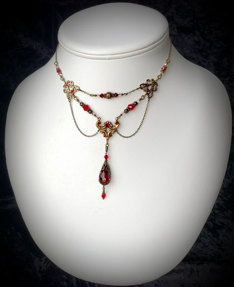 "Ox Blood Red Gothic Choker Crimson Victorian Dark Red Steampunk Necklace Scarlet Edwardian Antique Gold Bronze Titanic Temptations 18015 \"Scarlet Dangle Drop Choker\" NRB18015 1 Victorian Style Dangle Choker Necklace Handmade, Free Style Design Matching Earrings Available: Blood Red Faceted Crystals Red Swarovski Bicone Crystal Red Swarovski Crystal Rhinestones Clear AB Swarovski Bicone Crystals Antiqued Bronze Filigree Art Nouveau Connector Brass Findings Adjustable Soldered Chain Vintage Sty Dark Red Ruby Necklace, Red Fantasy Necklace, Red Jewlrey Aesthetic, Dark Red Necklace, Gold And Red Necklace, Dark Red Accessories, Gold And Red Jewelry, Dark Red Jewelry, Red And Gold Jewelry