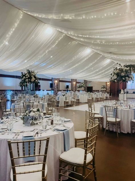 White Draped Walls Wedding, Hall Draping Wedding, Reception Draping Ideas, Wedding Ceiling Draping With Lights, Hanging Tulle From Ceiling, Ballroom Ceiling Decorations, Tulle Draping Wedding Ceiling Decor, Drapes On Ceiling, Wedding Drapery Ideas Ceilings