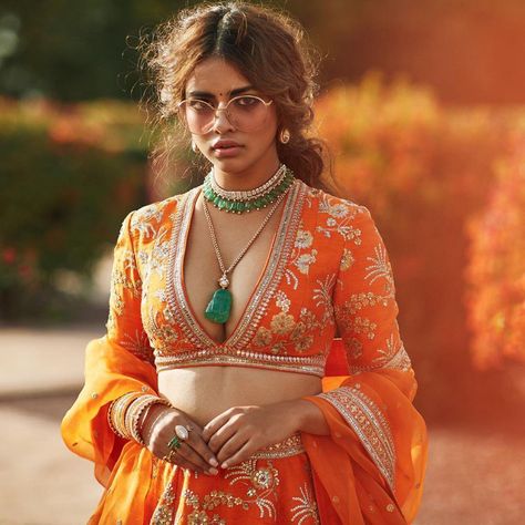 Stunning V neck Blouse design for brides | (C) Sabyasachi Mukherjee | Deep neck blouses | Orange Bridal Lehenga | Trending new blouse looks | Bride to be | Trousseau | Trending new blouse neck designs | Must have | #wittyvows #blouses #trousseau #trending #bridalwear #blousedesignideas #stunning #beautiful #deepneck #designs #orange #golden #embroidery Arabic Inspired Fashion, Pakistani Attire, Sabyasachi Collection, Khatli Work, Raw Silk Lehenga, Sabyasachi Lehenga, Saree Bollywood, Diesel Punk, Ritu Kumar