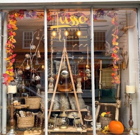 October, Autumn, Window Display, Baskets, Lanterns, Cushions, Pumpkins, Autumn Leaves, Candle Holders, Candle Stands Halloween Retail Display Ideas, Autumn Shop Window Display, Fall Window Display Store Fronts, Autumn Window Display Retail, Fall Store Window Displays, Fall Window Display, Halloween Window Display, Autumn Window Display, Bookstore Ideas