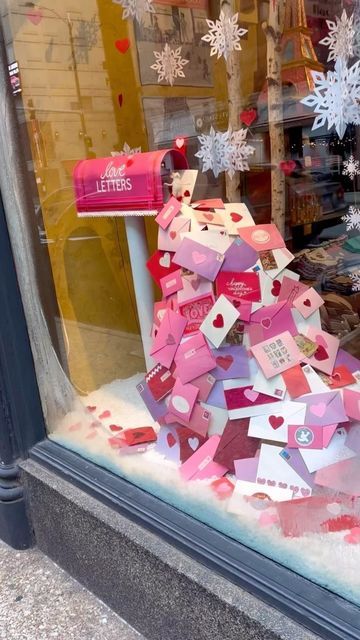 P.O.S.H. Chicago on Instagram: "We’re nothing if not happy fools in love!💘  It may be frigid cold outside, but our current shop windows are sure to warm your heart as they celebrate the most romantic day of the year…just one month away, it’s Valentine’s Day!  : : : #poshchicagoshop #valentines #valentinesday #loveletters #youvegotmail #shopdisplay #shopwindows #whydofoolsfallinlove #bemine #💘" Valentines Window Display, Christmas Shop Window, Flower Shop Decor, Holiday Window Display, Valentines Party Decor, Store Design Boutique, Alternative Christmas Tree, Shop Windows, Library Displays