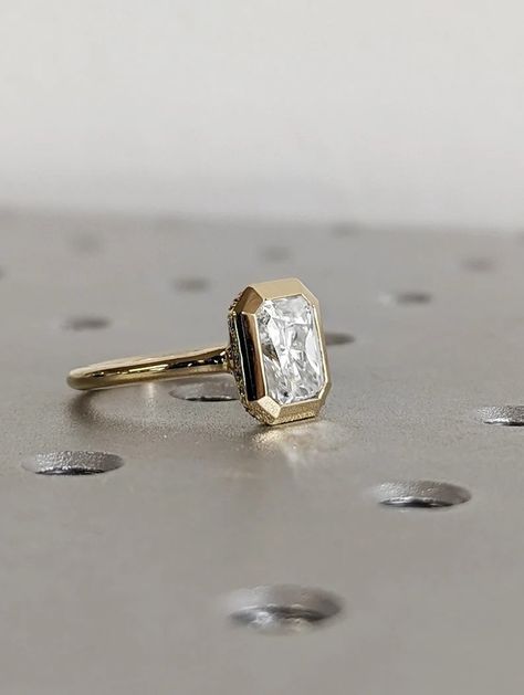 MAIN STONE
Type: Braverman Moissanite
Cut: Radiant
Color: D
Clarity: VVS

#1.5ct #Radiant #Cut #Moissanite #Solitaire #Bezel #Setting #Engagement #Ring #14K #Yellow #Gold #Diamond #Hidden #Halo #Promise #Ring #Statement #Ring #anniversary #ring #engagement #ring #promise #ring #statement #ring #wedding #ring #yellow #gold #ring #bezel #set #ring #radiant #moissanite #moissanite #gold #ring #moissanite #solitaire #gift #for #her #hidden #halo #ring #unique #ring Bezel Setting Engagement Ring, Bride Era, Engagement Ring Types, Setting Engagement Ring, Radiant Moissanite, Personalized Wedding Rings, Bezel Set Engagement Ring, Timeless Engagement Ring, Radiant Engagement Rings