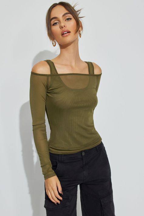 This top is absolute baddie mode. The layering options... our heads are spinning. Features - Layered Construction - Off-the-shoulder neckline - Fixed shoulder straps at underlay - Sheer mesh Size & Fit - Fit: Fit and stretch - Length: Cropped - Model is wearing size S Materials & Care - Content: 90% polyester, 10% spandex - Care: Machine wash, cold - Imported Layered Mesh Top Outfit, Mesh Long Sleeve Top Outfit, Mesh Top Outfit, Long Sleeve Top Outfit, Tank Top Layering, Layered Crop Top, One Shoulder Shirt, Outfits 2000s, Layering Tank Tops