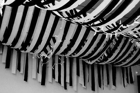 Streamer Decorations Ceiling, Halloween Streamers Decorations, Emo Night Party Decorations, Ceiling Halloween Decorations, Halloween Streamer Ideas, Beetlejuice Office Decorations, Wednesday Party Decor, Goth Party Decorations, Halloween Ceiling Decor