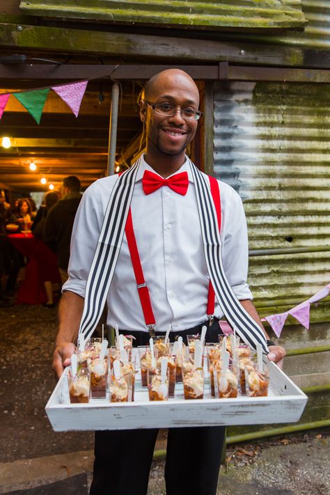 Server outfits red bow tie and suspenders with vendor trays for passed appetizers Carnival Theme Food Ideas, Circus Cocktails, Circus Outfit Ideas, Carnival Theme Party Outfit, Circus Theme Party Outfits, Server Outfits, Passed Appetizers, Circus Food, Deco Cinema