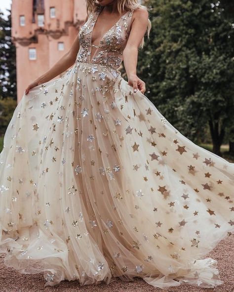 Scattered with a galaxy of sequined stars in shimmering silver and gold, this celestial tulle gown is guaranteed to shine bright on your big day. A deep v-neckline is mirrored by the plunging back, while two bands at the waist create a flattering silhouette. | Photo: @champagneunicorns Star Gown, Orion Dress, 2021 Prom Dresses, Celestial Wedding, Princess Ball Gowns, Ball Gowns Evening, Long Prom Dresses, Tulle Prom Dress, Long Wedding Dresses