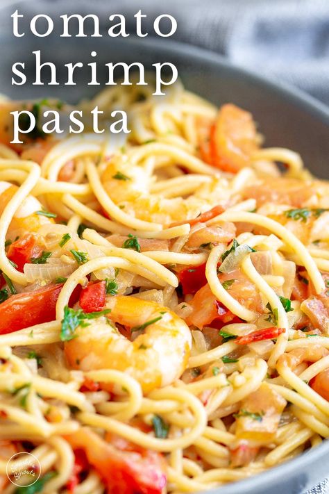 This quick and easy Shrimp Tomato Pasta is a simple dish with so much flavor from so few ingredients. The simple sauce is loaded with garlic and then finished with fresh tomatoes. If you love shrimp scampi, you will love this Shrimp Tomato Pasta Dinner! Ready in just 20 minutes, this pasta is delicious! Sweet shrimp combined with the tangy sweet fresh taste of ripe tomatoes all tangled around perfectly cooked pasta. Shrimp With Fresh Tomatoes, Shrimp Pasta Recipes With Tomatoes, Pasta With Grape Tomatoes, Shrimp Tomato Pasta, Shrimp With Tomatoes, Summertime Meals, Shrimp Tomato, Shrimp Pasta Recipes Easy, Fresh Tomato Pasta