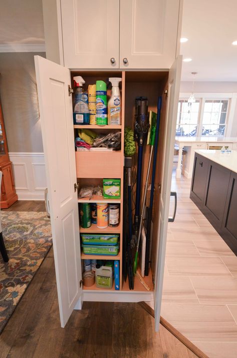 This custom cabinet was built to help hide and organize these homeowner's cleaning supplies, while still seamlessly blending in with the rest of the kitchen. Broom Cabinet, Broom Storage, Spec Home, Cleaning Supply Storage, Cleaning Cabinets, Utility Closet, Pantry Remodel, Mudroom Laundry Room, Laundry Room Renovation