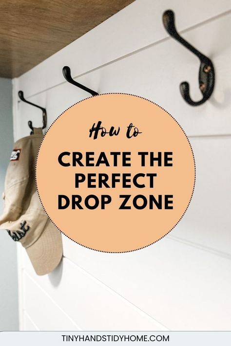 Wall hooks on a white shiplap wall. The text over the image reads, "how to create the perfect drop zone". Diy Drop Zone Small Spaces, Entryway Coat Hanger Ideas, Jacket Hooks Entryway, Backpack Hook Ideas, House Drop Zone, Small Corner Entryway Ideas, Drop Off Zone Entryway, Home Drop Zone, Small Drop Zone Ideas