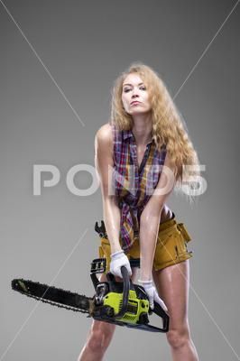 Beautiful hot blond woman hold a chainsaw Stock Photos #AD ,#blond#woman#Beautiful#hot Chainsaw Poses Reference, Chainsaw Pose Reference Drawing, Holding Bazooka Pose, Holding Chainsaw Pose Reference, Holding Shovel Pose Reference, Chainsaw Reference Drawing, Holding Chainsaw Pose Reference Drawing, Chainsaw Pose, Person With Chainsaw Reference