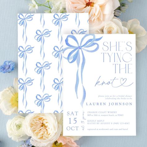 Celebrate the bride-to-be with our exquisitely designed blue watercolor bridal shower invitation, featuring a delicate bow and the charming headline "She's Tying the Knot." This invitation is the perfect blend of modern elegance and timeless beauty, setting the tone for a memorable celebration.  Elegant Watercolor Design: The invitation showcases a stunning blue watercolor background that adds a touch of sophistication and grace. The gentle wash of blue hues creates a serene and inviting atmosphere, perfect for a bridal shower. Charming Bow Accent: At the center of the design, a beautifully illustrated bow symbolizes the bride's journey towards tying the knot. The bow adds a sweet and whimsical touch, enhancing the overall elegance of the invitation. Modern Typography: The headline "She's Blue And White Bridal Shower Invitations, Bows And Pearls Bridal Shower Theme, Timeless Bridal Shower Ideas, Bridal Shower Decor Blue, Bridal Shower Themes Blue, Baby Blue Bridal Shower Ideas, She’s Tying The Knot Bridal Shower Invites, Bridal Shower Something Blue, Bridal Shower Blue Theme