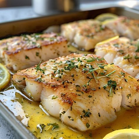 Garlic and Lemon Baked Cod Cod Baked In Foil With Leeks And Carrots, Garlic Lemon Cod, Link Cod Recipes, Mediterranean Baked Cod Recipes, Sablefish Recipes Baked, Baked Cod With Lemon And Garlic, Oven Baked Cod Recipes, Sheet Pan Cod, Sablefish Recipes