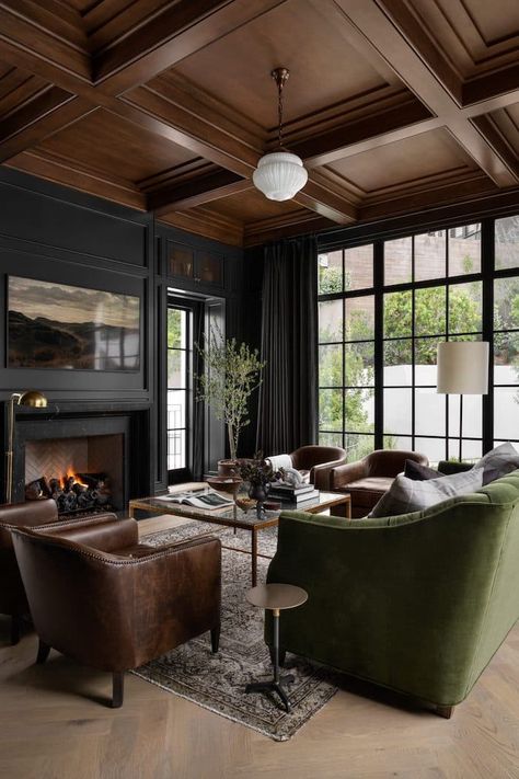 5 Ways To Create A Whole Home Paint Color Scheme. Modern living room with black walls and wood ceiling. Moody Media Room, Hilltop Estate, Moody Interior Design, Mission Style Homes, Dark Accent Walls, Moody Living Room, Home Paint Color, Home Paint, Moody Decor