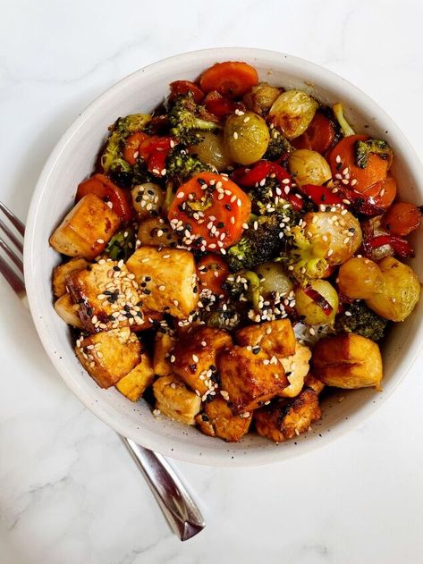 Air Fryer Teriyaki Tofu served with stir fried vegetables and rice noodles is a delicious and easy meal to make. The crispy tofu combined with the vegetables and delicate rice noodles is the perfect combination. Why do I need to press tofu?Pressing tofu helps the tofu absorb more of the marinade you soak it in plus it will help it get crispy when cooking. It is not a necessary step but definitely one that will make a difference in this recipe and most tofu recipes.This is a simple s… Pressing Tofu, Press Tofu, Vegetarian Lo Mein, Stir Fried Vegetables, Vegetables And Rice, Hamburger And Potatoes, Teriyaki Tofu, Marinated Tofu, Crispy Tofu