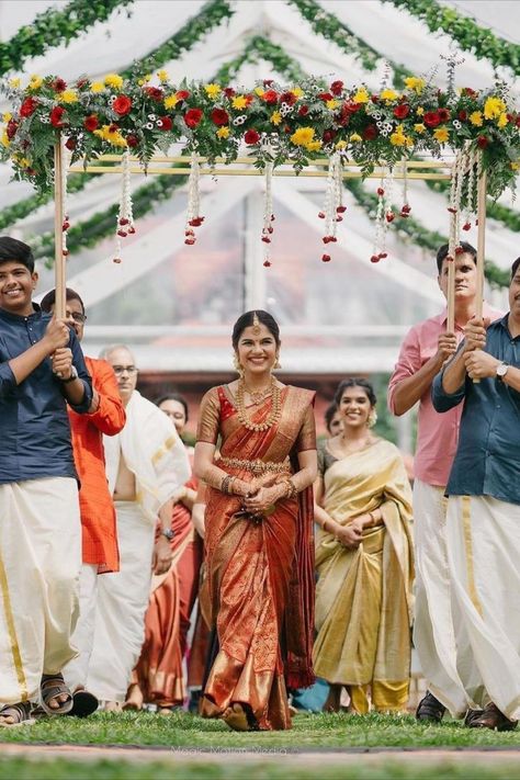 Simple south Indian bridal entry! We love a good bridal entry! It not only sets up the stage for a beautiful wedding day but also is a great way for the bridal reveal. This is one walk down the mandap or aisle that you will remember for a lifetime. So how do you make it one of a kind? We’ve done your homework for you and rounded up the most unique ideas that we loved for a bridal entry. Read on and bookmark your favourite one now! Unique Bridal Entry, Indian Bridal Entry, South Indian Engagement, Bridal Entry Ideas, Malayali Bride, Indian Wedding Aesthetic, Indian Wedding Stage, Bridal Entry, Indian Engagement