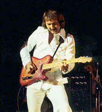 James Burton, Elvis's guitar man, was also called King of the Telecaster. And... he wrote "Mystery Train". Pictured with his pink paisley Tele. Elvis Guitar, James Burton, Mystery Train, King Elvis Presley, Elvis Presley Music, Leo Fender, Ricky Nelson, Roy Orbison, White Suit