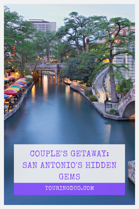 A vibrant evening scene at San Antonio Riverwalk with a serene river, colorful umbrellas lining the walkway and lush green trees framing historic architecture. Overlay text promotes 'Couple's Getaway: San Antonio's Hidden Gems' at TouringDuo.com. San Antonio Couples Trip, Marriage Island San Antonio, Romantic Restaurant San Antonio, San Antonio Texas Things To Do, San Antonio Things To Do Couples, Things For Couples, San Antonio Things To Do, San Antonio Vacation, San Antonio Hotels