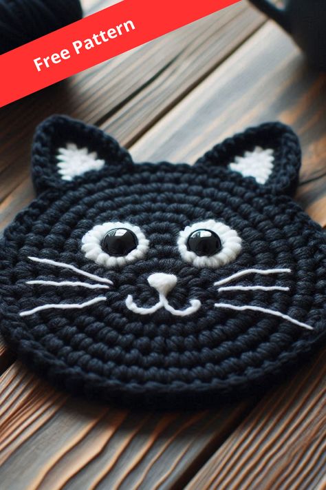 Learn how to crochet a black cat coaster with this easy pattern. Perfect for adding a charming and functional touch to your home! Cat Eyes Crochet Pattern, Crochet Cat Nose Free Pattern, Crochet Cat Face Pattern, Crochet Pattern For Cats, Easy Cat Amigurumi Free Pattern, Crochet Cat Head Free Pattern, Crochet Cat Gifts, Free Crochet Cat Coaster Pattern, Free Crochet Patterns For Coasters