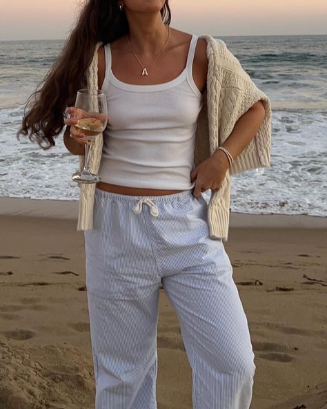 My favorite place to watch the sunset🤍 (and hair on level: Monica Gellar in Barbados iykyk)😂 Outfit Details!! Pants: @brandymelvilleusa Top: @oldnavy Sweater: I actually can’t remember but have a similar one linked in my Amazon! #beachsunset #casualoutfitideas #newportbeach Winter On The Beach Outfits, Beach Cozy Outfit, Beachy Aesthetic Outfits Winter, Florida Keys Aesthetic Outfits, Winter Beachy Outfits, Warm Beach Outfit, Cozy Beach Outfits, Barbados Clothing, Beachy Aesthetic Outfits