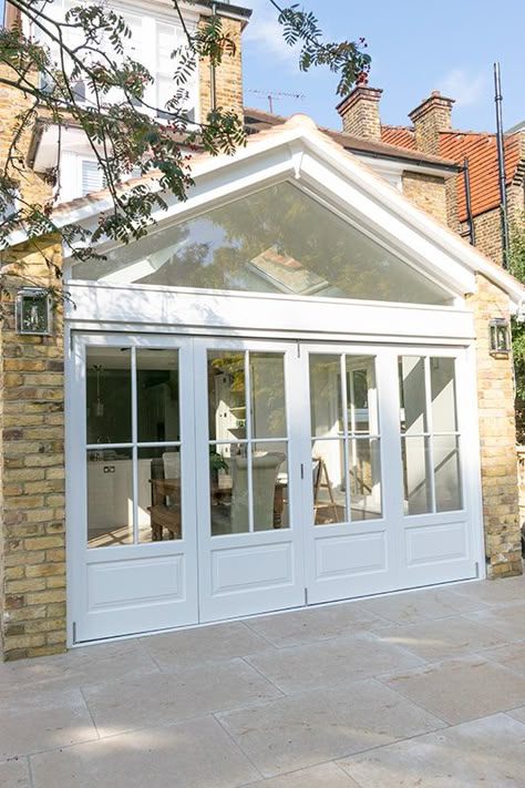 Solid wood bifold doors | Wooden bi fold doors Enfield Wood Bifold Doors, White Bifold Doors, External Bifold Doors, Wooden Bifold Doors, Orangery Extension, Pintu Interior, Gable Window, Home Extensions, Home Extension