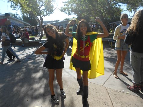 Super Hero Day My best friend and I dressed up as batman and Robin. My Robin outfit was homemade. These are some item's I used to help me create my Robin outfit: -Plain red tank top/ Green shirt/ black skirt( Savers) -Yellow cape ( made out of a laundry bag) -Yellow Ribbon/Felt material ( Joe Ann's) This cost me a total of $12 dollars Robin And Batman Costumes, Hero's Vs Villains Spirit Week, Superhero Football Theme Outfit, Batman And Robin Halloween Costumes, Batman And Robin Costume For Women, Superhero Duo Costumes, Super Hero Spirit Day Outfit, Superhero Spirit Day Outfit, Robin Costume Women