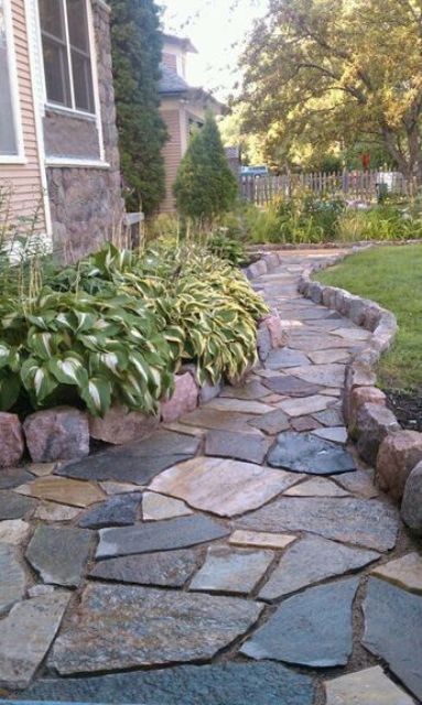 an elegant rough stone garden path with a high border looks stylish and very textural Stone Garden Paths, Side Yard Landscaping, Walkway Landscaping, Pathway Landscaping, Walkways Paths, Flagstone Patio, Garden Stepping Stones, Stone Walkway, Garden Walkway