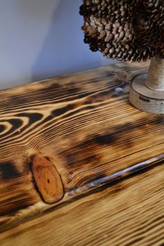 One of the most dramatic finishing effects is burning wood to bring out the grain. Here's a quick and fast project that highlights this distinctive technique. Burned Wood Finish, Burnt Wood Finish, Burn Wood, Torch Wood, Wood Floor Design, Burned Wood, Wood Furniture Plans, Burning Wood, Charred Wood