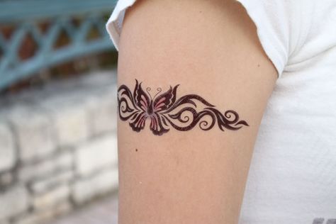 butterfly tattoo Butterfly Band Tattoo, Butterfly Arm Band Tattoo, Arm Wrap Tattoos For Women Butterfly, Butterfly Tattoo Wrapped Around Wrist, Bracelet Butterfly Tattoo, Wrap Around Wrist Tattoos Butterfly, Classy Tattoos For Women, Ankle Bracelet Tattoo, Strength Tattoo