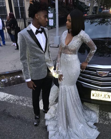 Image may contain: 3 people, people standing and wedding Silver Hoco Couple, Silver Prom Suit Black Men, Silver Prom Dress Black Couple, Silver Prom Couple, Prom Boys Outfit Suits, Silver Prom Suits, Prom Tuxedo Ideas, Long Sleeve Prom Dress Mermaid, Prom 2k23