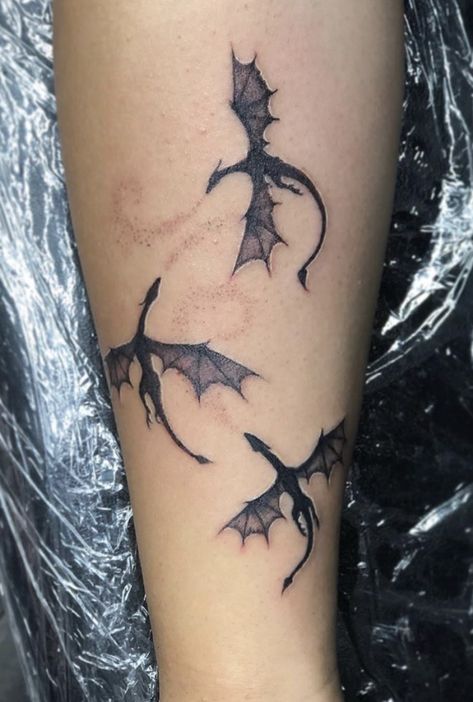 Black and white three dragon tattoo done by Artist @kingkonejo #smalltattoos #dragontattoo #gameofthrones #gameofthronestattoo #cooltattooideas #tattoos #dopetattoos #art #dragonart Three Dragon Tattoo, Dragon Tattoo Ideas, Tattoo Artist Tattoo, Small Dragon Tattoos, Tattoo Design Tattoo, Kunst Tattoos, Dragon Tattoo For Women, Flame Tattoos, Forearm Tattoo Design