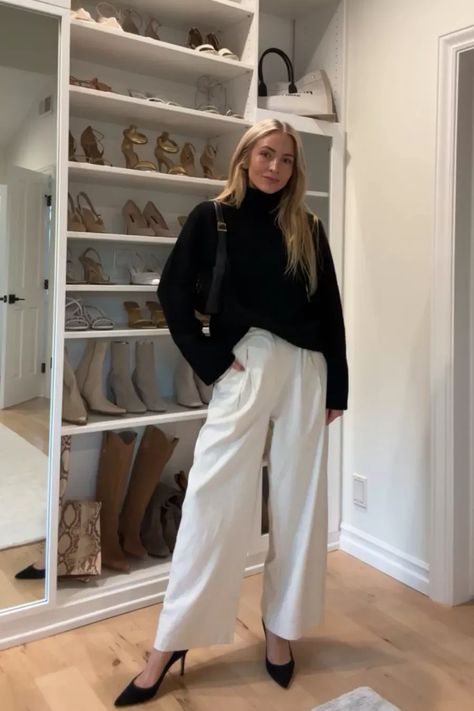 Repeating this chic black and white winter outfit all season 🖤 I styled this black cashmere turtleneck sweater with loose trousers and classic black heels. Tap to shop and bring this fashion inspo to life! White Trousers Outfit Autumn, White Turtleneck Outfit Work, Chic Turtleneck Outfit, Black Turtle Neck Sweater Outfit Women, Trouser And Sweater Outfit, White Turtle Neck Outfit Ideas, White Trouser Winter Outfit, Cream V Neck Sweater Outfit, Trousers And Heels Outfit Ideas