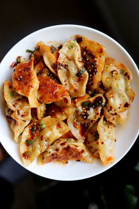 Pork and chive dumplings smothers in delicious chili oil. Dumplings Recipe Chinese, Pork And Chive Dumplings, Chive Dumplings, How To Make Dumplings, Homemade Dumplings, Pork Dumpling, Toronto Food, Dumpling Recipe, Chili Oil